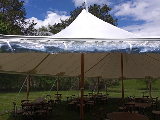 Clear roll-up sidewalls on a Baystate Tent & Party sailcloth tent
